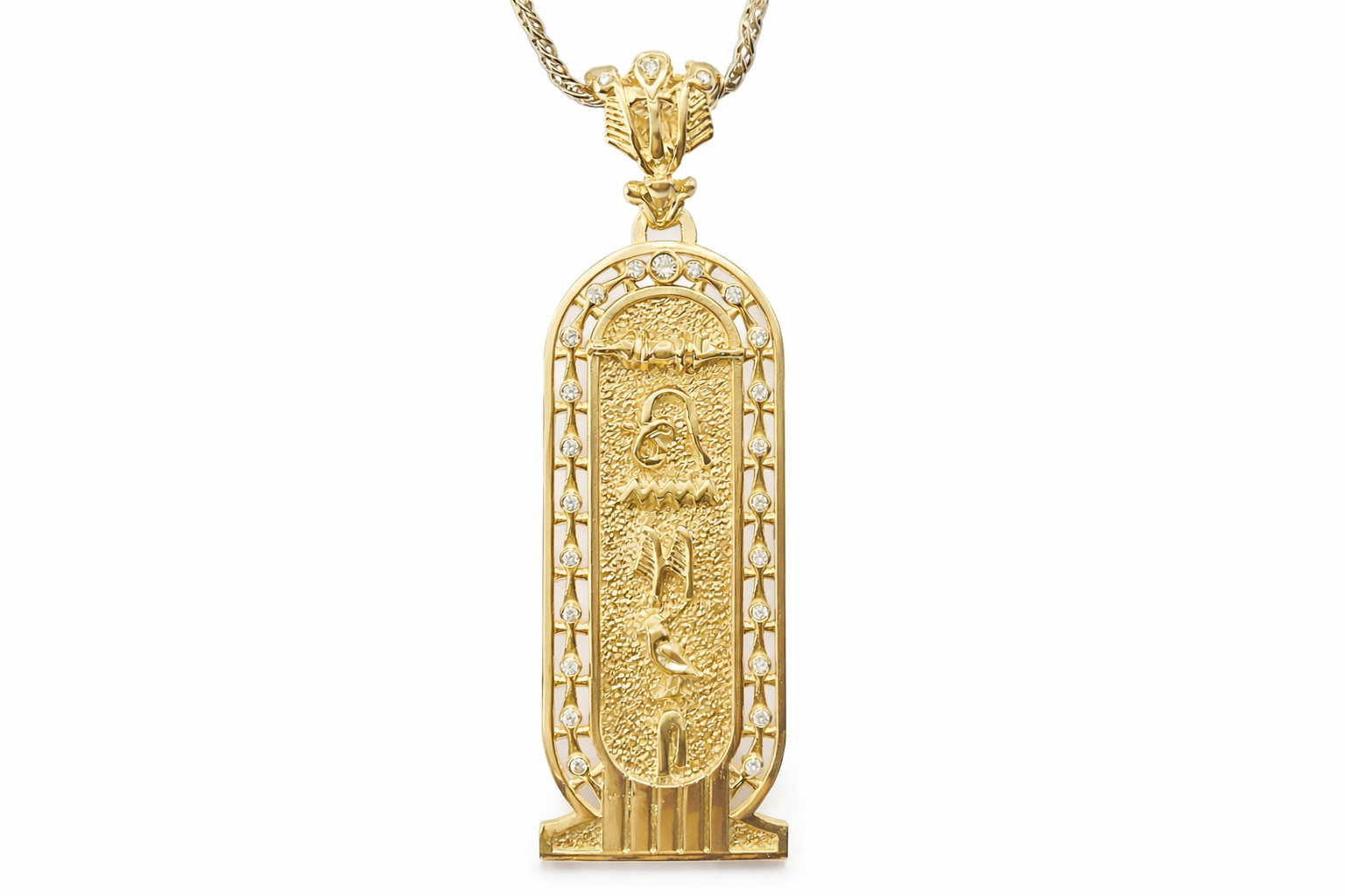 Gold pendant with hieroglyphic design on a white background