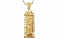 Gold pendant with hieroglyphic design on a white background