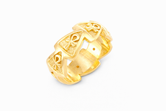 18k yellow Gold ring with intricate ankh designs within pyramids on a white background