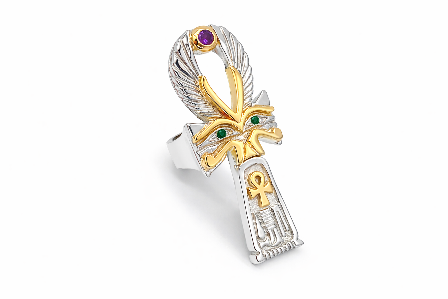 Gold and silver ring of a large ankh symbol on a white background