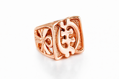 Rose gold gye nyame signet ring with intricate design on a white background