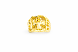 Gold ring with an ankh symbol on a white background