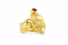 side view of a 18k Yellow Gold Winged Scarab ring with flanking cobras and wings that make up the band.