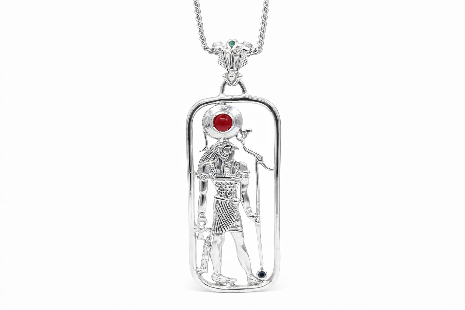 A sterling silver pendant featuring a filigree design with a figure of Heru, including Amethyst, carnelian, and emerald stones, attached to a gold-tone chain.