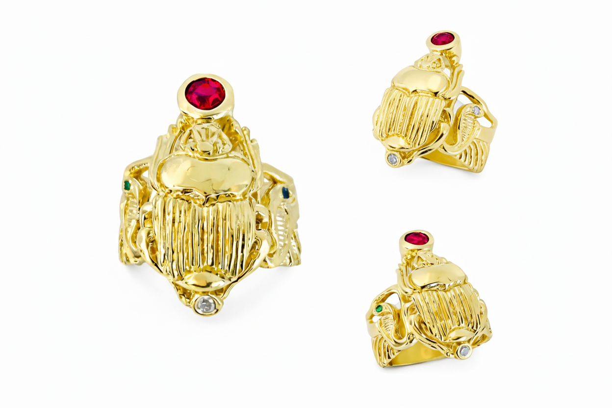 three angles of a 18k Yellow Gold Winged Scarab ring with flanking cobras and wings that make up the band.