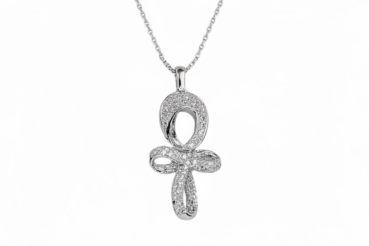 A white gold Infinity Ankh pendant with a central white diamond surrounded by smaller white diamonds, on a chain.