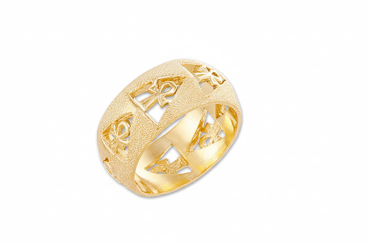 A gold-colored, textured band ring featuring geometric cutouts and an Ankh symbol design.