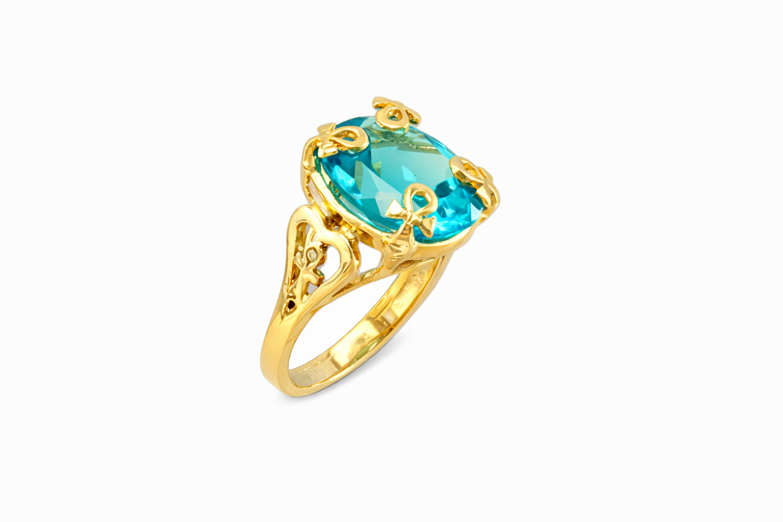 Gold ring with a blue gemstone on a white background