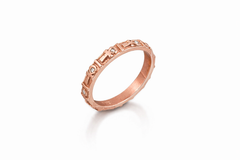 Rose gold ankh band with engraved design on a white background