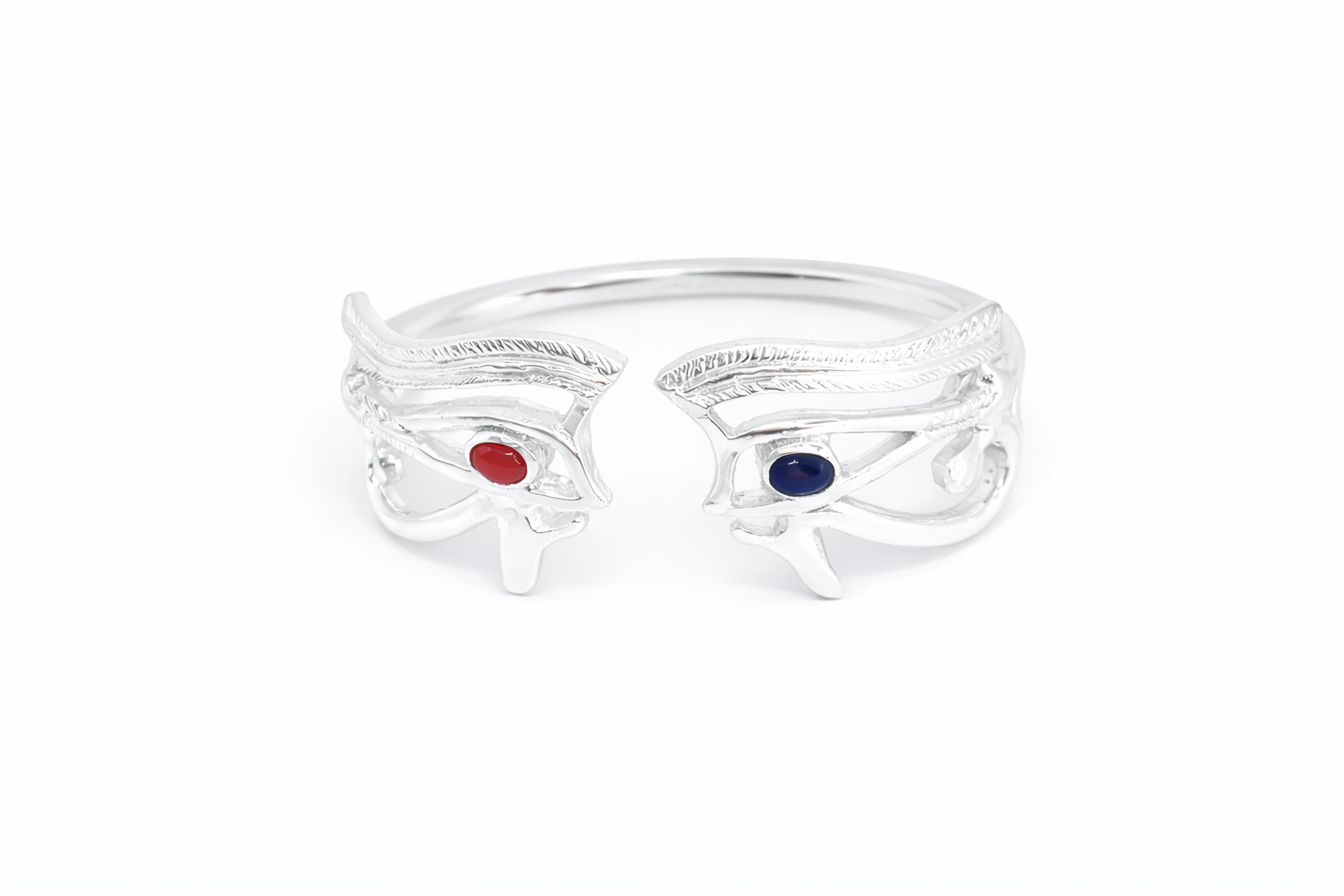 Large silver eye of Heru or eye of Horus ring with gemstones on a white background