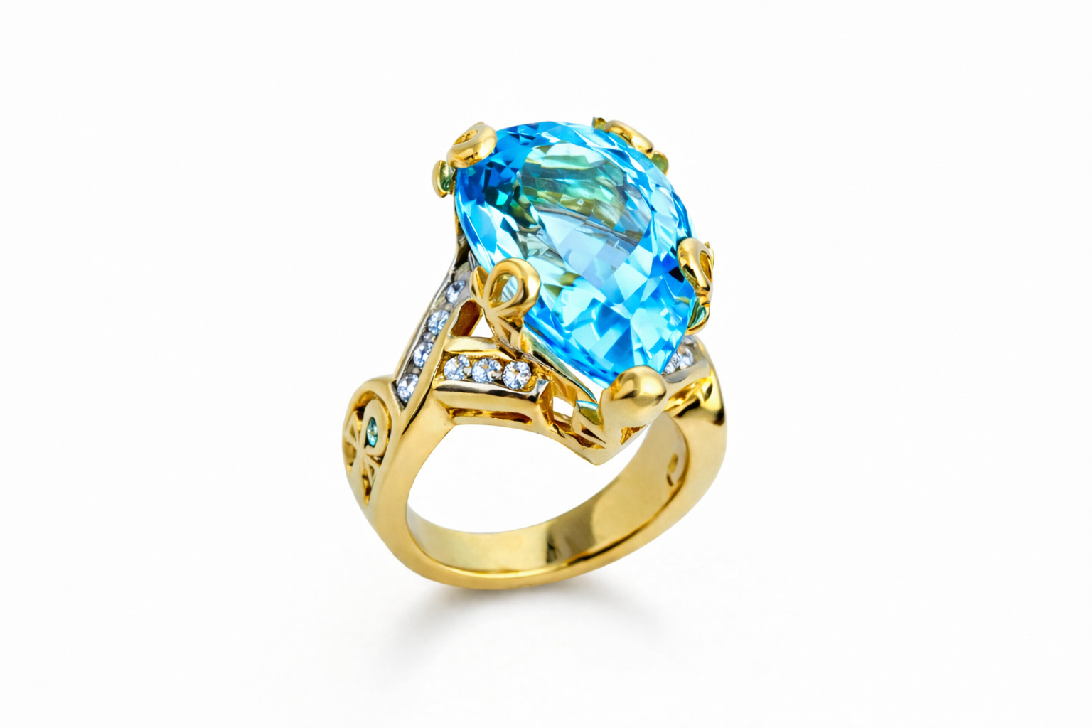 Gold ring with a large blue gemstone on a white background