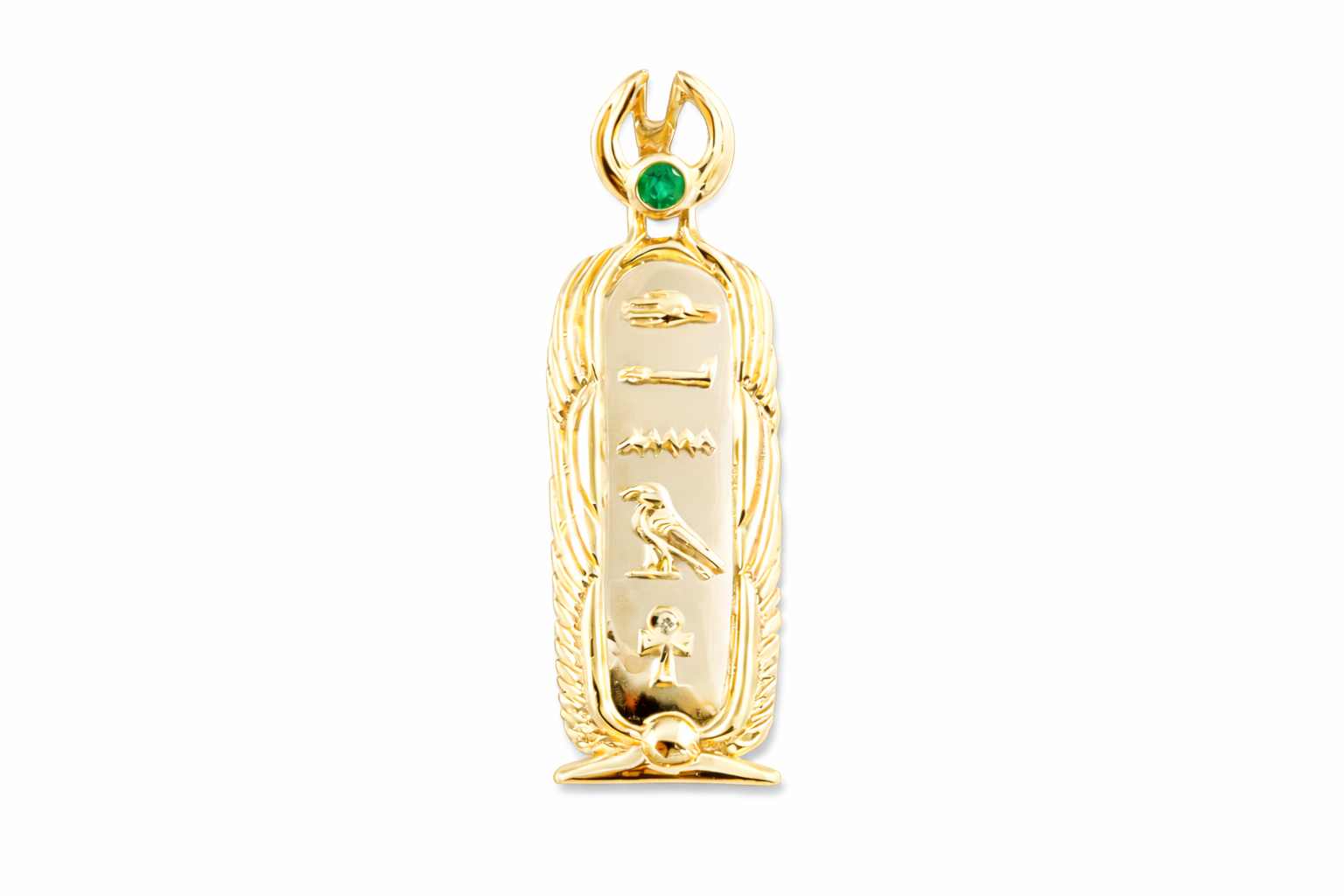 Gold pendant called a cartouche with a name in Ancient Egyptian hieroglyphics and a green gemstone on a white background