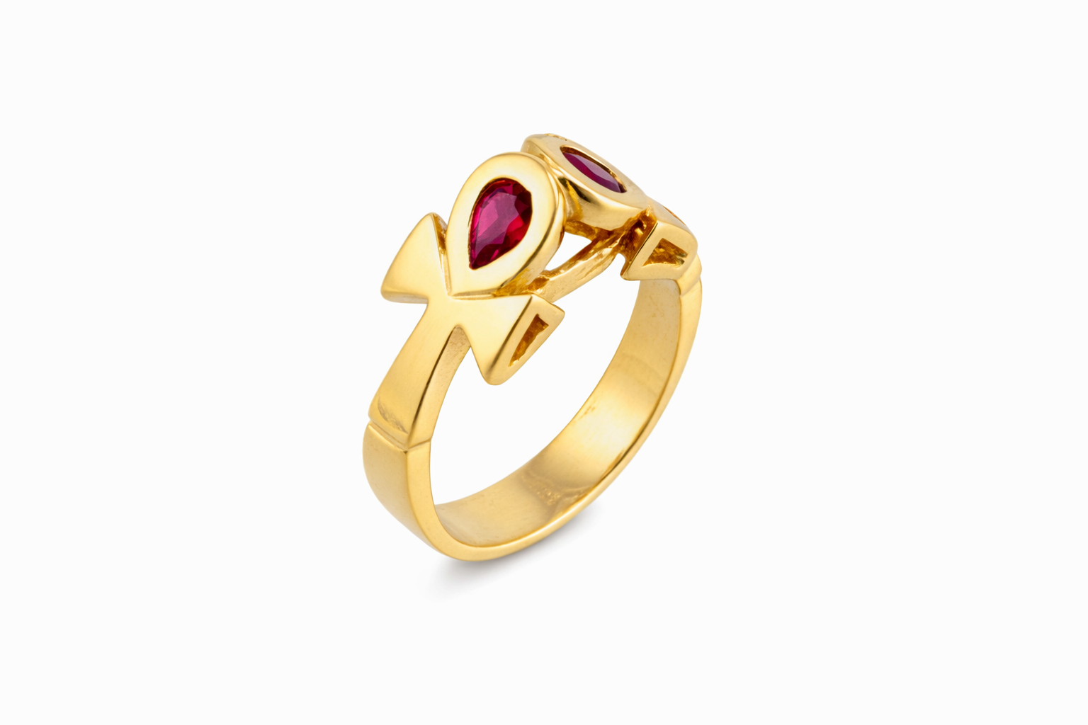 A yellow gold double ankh ring with both ankhs featuring a red ruby.