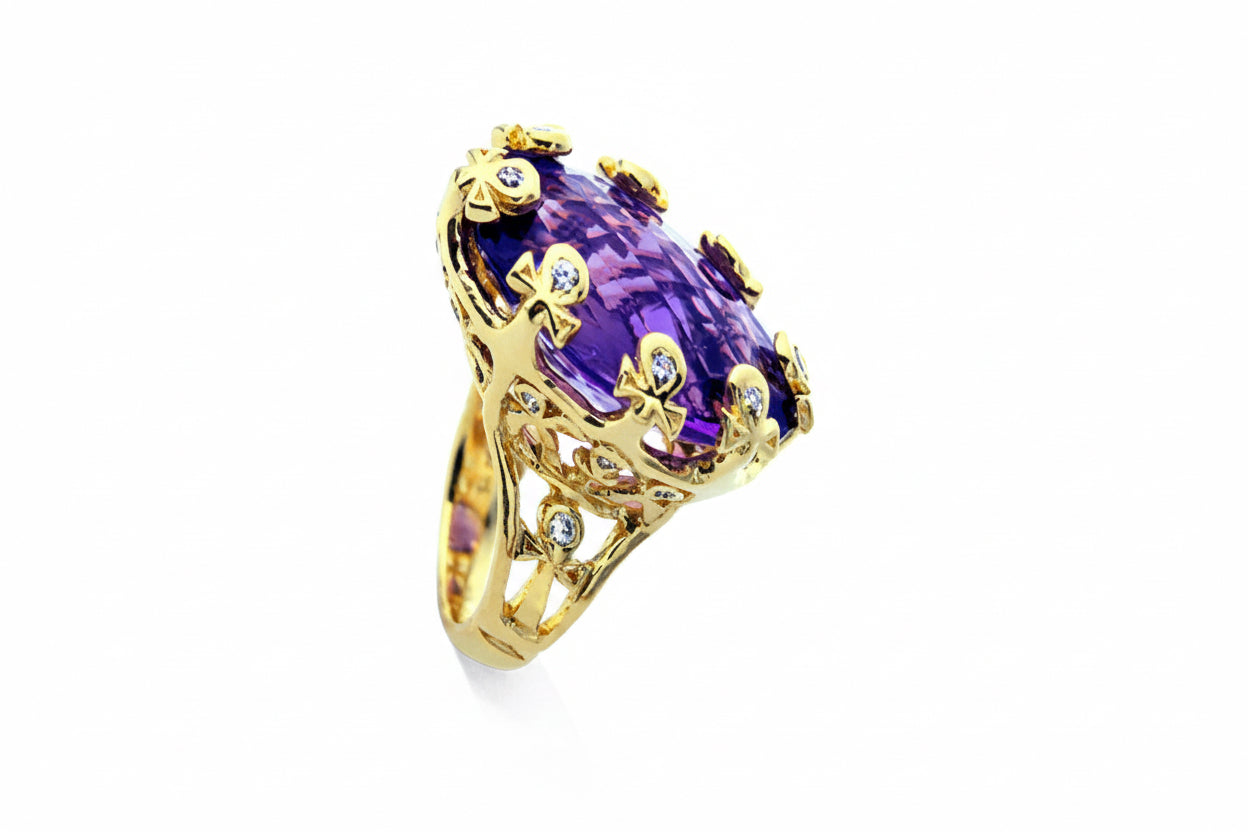 14k yellow gold cocktail ring with amethysts and diamond clad ankhs. 