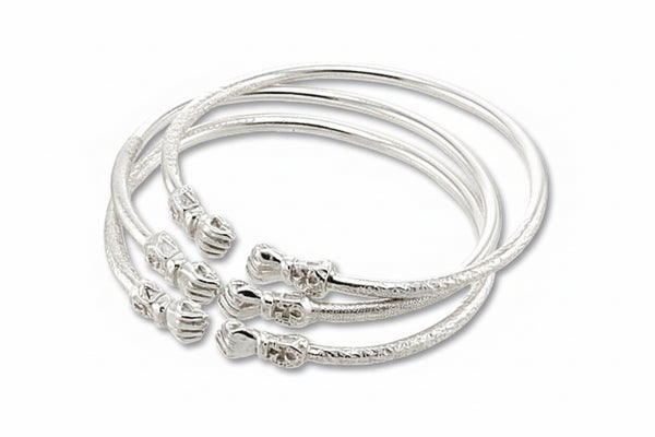 A set of three sterling silver fist bangles with a textured design and ankhs etched in the design.
