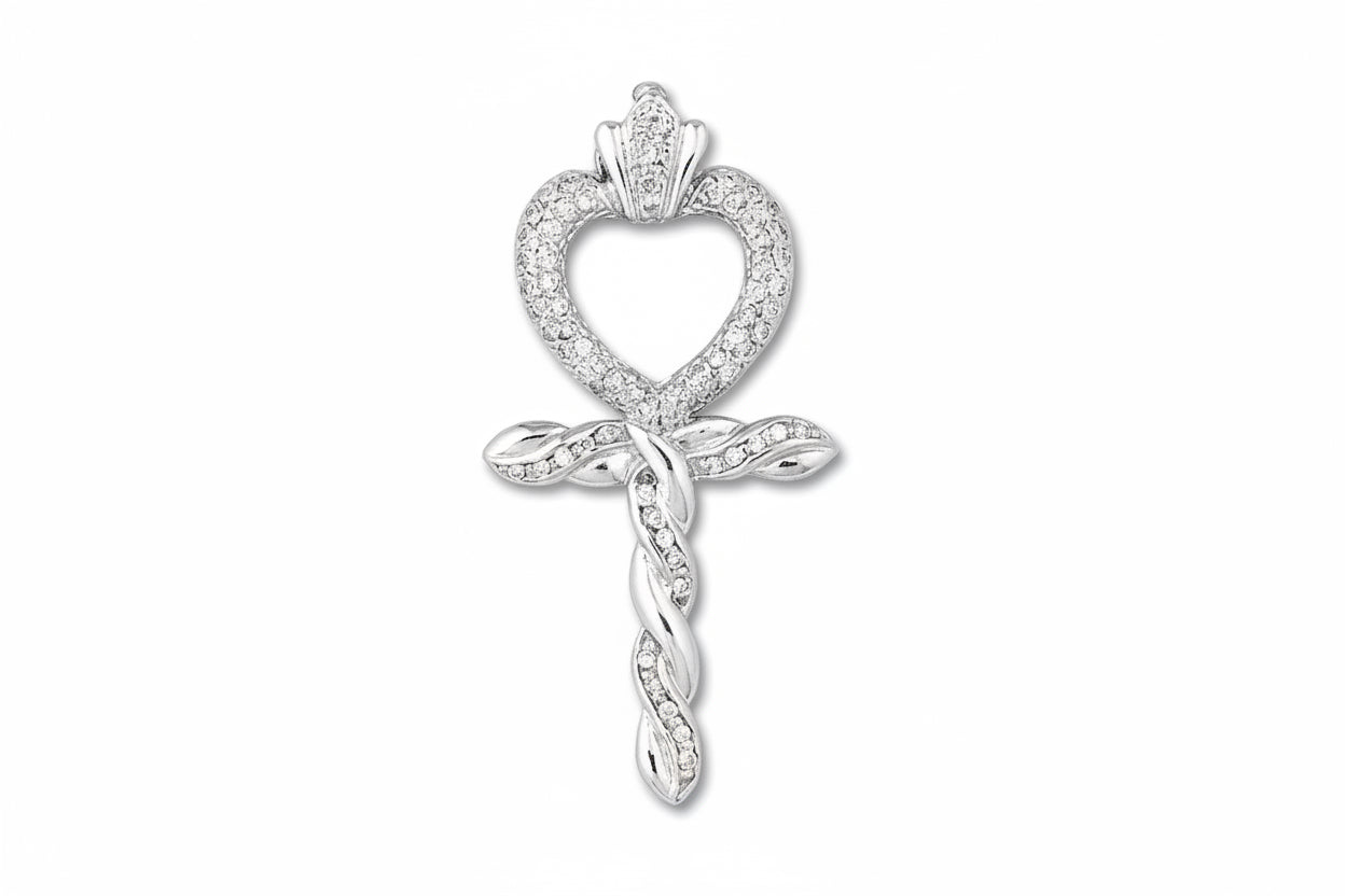 An 18k white gold and diamond Ankh heart pendant in a pave setting.