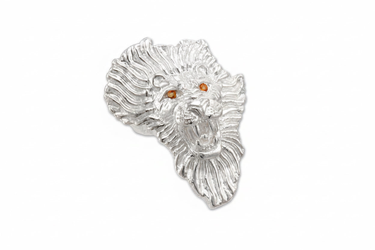 A sterling silver ring featuring a detailed design of a lion's face, in the shape of the map of Africa, with citrine gemstones in the eyes in the shape of the map of Africa.