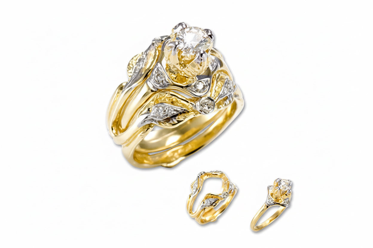 A yellow gold engagement ring with a central diamond flanked by two smaller diamonds, along with a detachable inner ring.