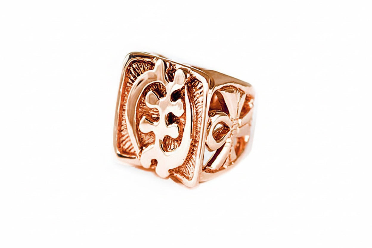 A rose gold signet ring featuring the Adinkra symbol Gye Nyame and two Ankhs on the sides.
