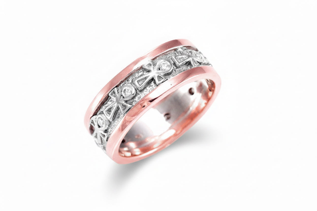A rose and white gold ankh wedding ring with white diamonds set within each ankh, featuring a classic design with rose gold borders.