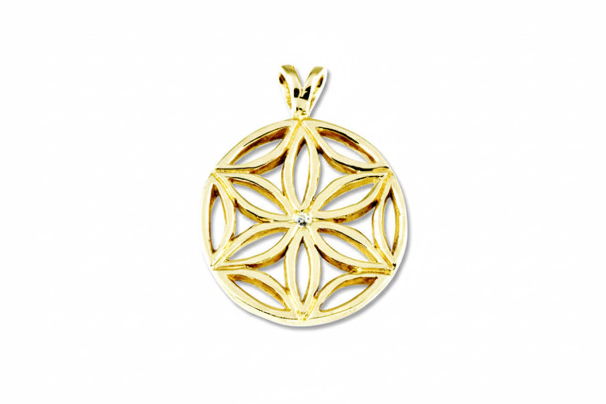 A 14k yellow gold pendant featuring a geometric flower of life design with a central white diamond, on a chain.